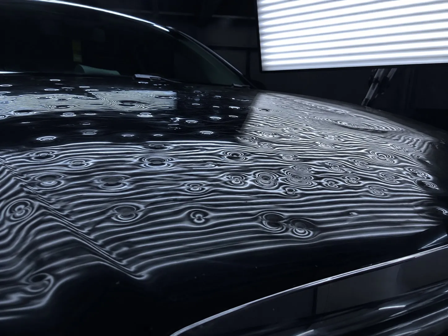 Before: hail-damaged hood